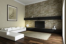 Das Bild zeigt ein modernes Zimmer mit einer Wandheizung an der Innenwand.